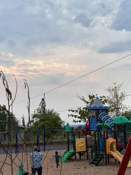 The play area and adventure tower offer a variety of activities in one place. While some team members tackle the zipline, others can enjoy the swings and slides below.