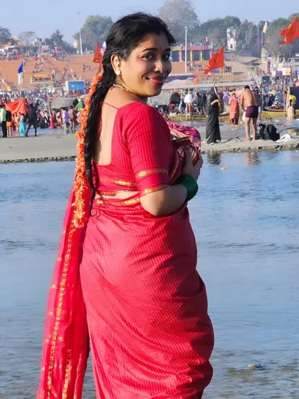 A moment of peace and reflection at the banks of the Triveni Sangam, amidst the vibrant energy of the Kumbh Mela.