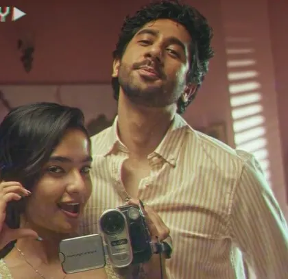 A fun, playful shot of the couple from The Man Company film. Their coordinated yet distinct styles reflect their personalities and their connection as a couple.