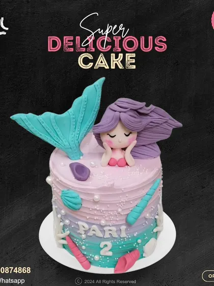 Dive into an underwater dream with this mermaid cake. It features a lovely mermaid with purple hair, a shimmering tail, and delicate seashell details, personalized for a second birthday.