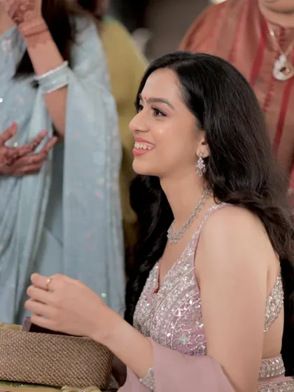 A candid shot capturing her natural smile. The makeup is designed to enhance, not mask, creating a look that is effortlessly beautiful.