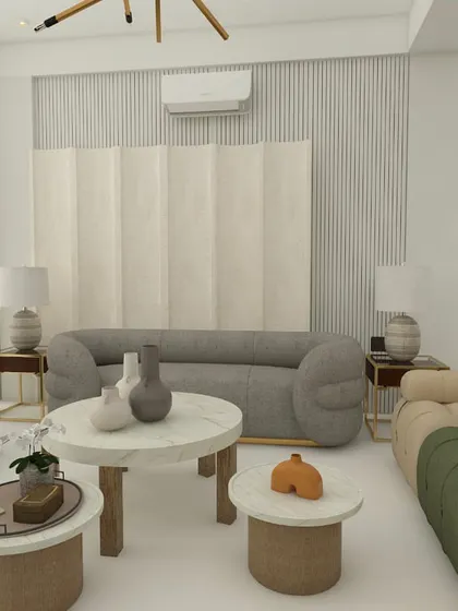 A wide view of the spacious living room, showing multiple seating areas and the use of different textures and shapes to create a cohesive yet dynamic design.