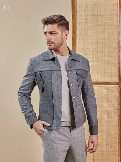 This grey shacket with unique pocket detailing offers a playful edge on a monochrome look. It's a versatile piece for smart casual occasions from travel to evening events.