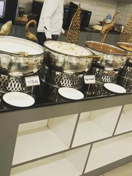 A full view of the buffet spread for 110 guests at ChargePoint Technologies Pvt Ltd. The setup includes a variety of main courses and sides to cater to diverse tastes.