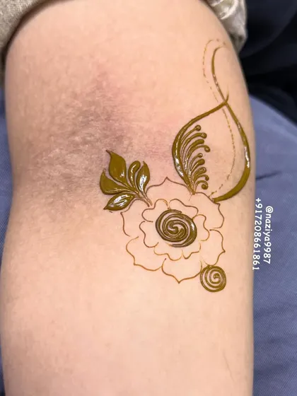 This is how the design starts, with a simple outline of a rose and a few leaves. It's the foundation for a more intricate pattern.