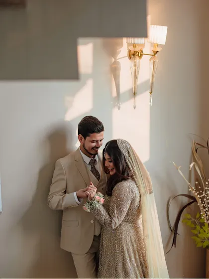 A sweet, intimate moment between Uzma and Amir during their engagement celebration, captured in beautiful, soft light.