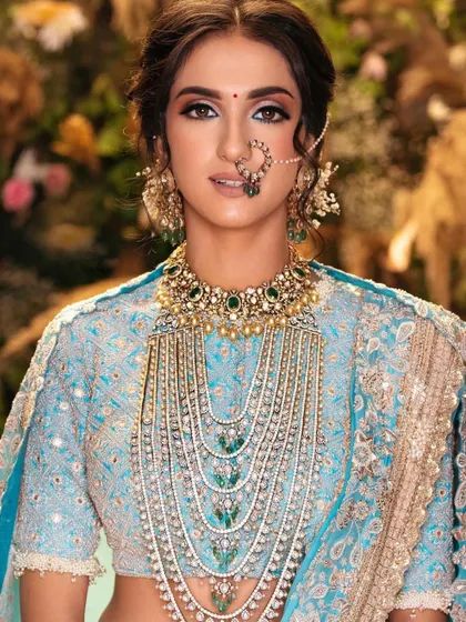 A close-up of a modern bride with an ethereal, dreamy look. The focus is on luminous skin and soft, blended eyeshadow, creating a romantic and timeless feel.