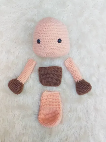 These are the separate parts of the platypus toy before I stitched them all together. You can see the head, body, arms, and feet, all created individually.