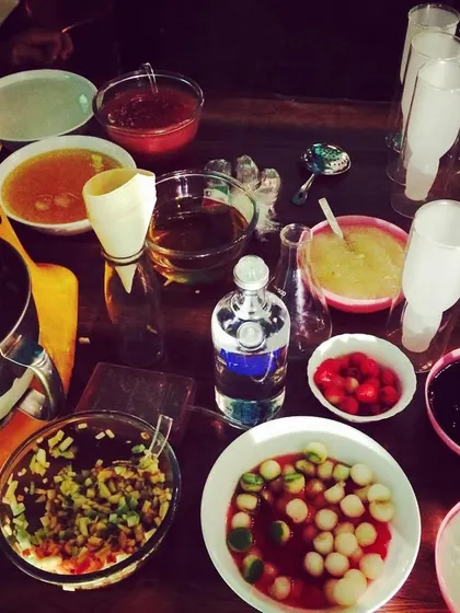 The prep station for a molecular gastronomy bar. You can see the various purees, infusions, and spherified ingredients ready to be mixed into scientific creations.
