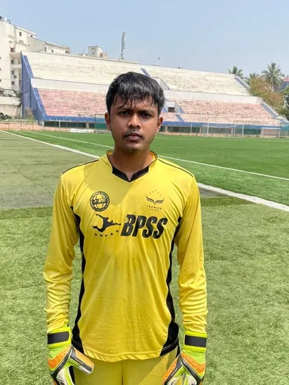 A portrait of our dedicated goalkeeper, Vishnu. His loyalty and skill are the bedrock of our team's defense.