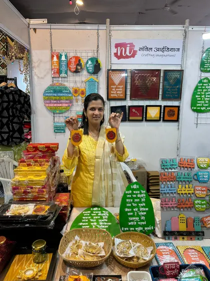 Day 2 at the Pandit Farms exhibition in Pune, holding up some of my festive decor items.