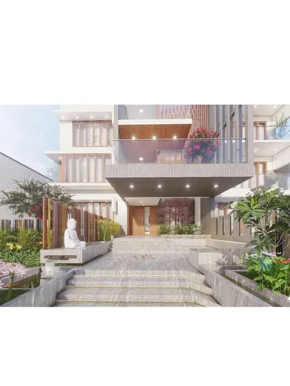 A detailed view of the entrance for a modern residence. The design features a grand staircase, integrated landscaping with a Buddha sculpture for tranquility, and a cantilevered porch that creates a welcoming entry point.