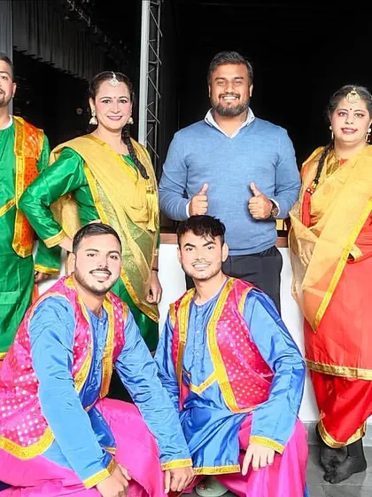A group photo with the talented Bhangra performers from a corporate awards show. I coordinate with multiple dance troupes to create a diverse and engaging entertainment lineup.