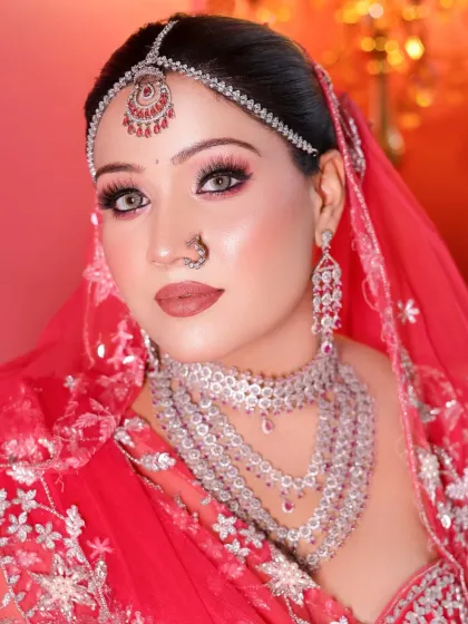 A student's take on a modern bridal look with a pink lehenga and diamond jewelry.