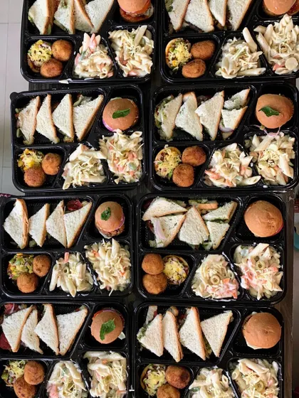 An overhead view of multiple movie party meal boxes, packed and ready for a fun evening.