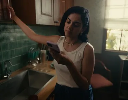 The main character in a simple, casual outfit, reflecting a typical day at home. This realistic styling helps the audience connect with her story.