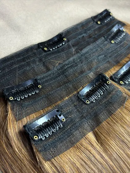 A close-up of my premium clip-on sets. The clips are lightweight and secure, with a silicone strip to prevent slipping and protect your natural hair.