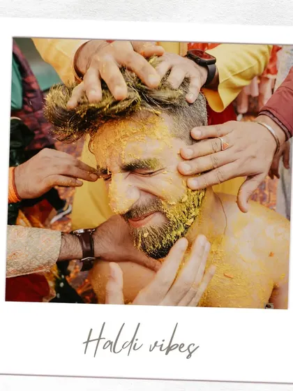 A close-up, artistic shot of the groom's Haldi, framed like a polaroid. This image focuses on the texture and emotion of the moment.