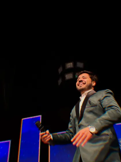 A candid shot of me enjoying the music and the moment on stage during a Sangeet night.