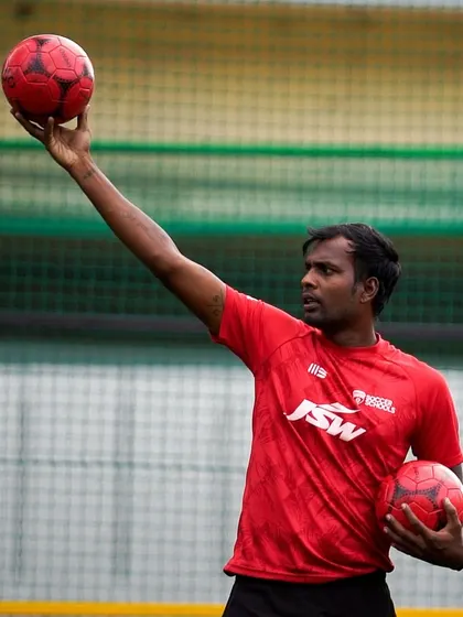 A coach demonstrates the correct technique for a throw-in. We emphasize mastering the fundamentals, as they are the building blocks for advanced football skills.