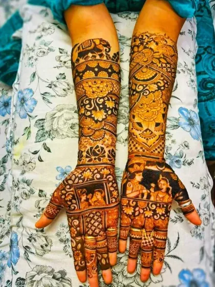 This design combines multiple stories, with portraits of the couple on the palms and traditional elephant motifs on the forearms. We can mix and match different themes to create your perfect bridal mehndi.