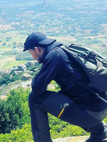 A closer look at the crouching pose overlooking the Shivagange valley, a great way to appreciate the scale of the landscape.