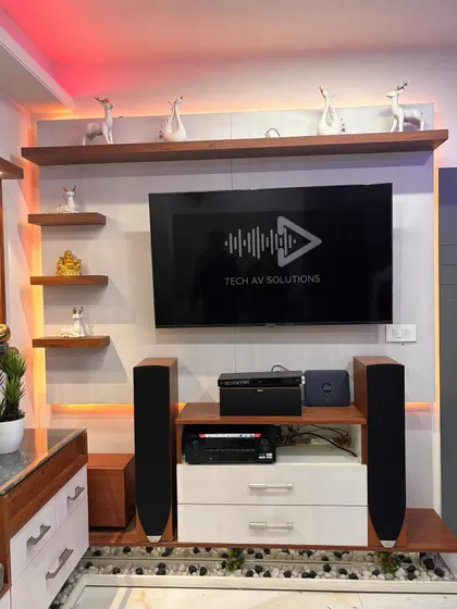 Here is a 7.2.2 home theater system I installed in a living room, built around a 55 inch LG TV. The setup includes Jamo speakers and a Denon AV receiver, creating a powerful surround sound experience that works beautifully within the existing TV unit.