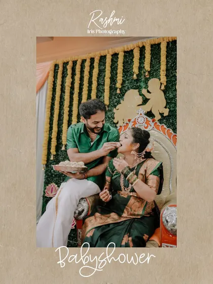 A joyful, candid moment from a baby shower ceremony. The husband is playfully feeding his wife a sweet, and their smiles show the fun and love shared during the event.