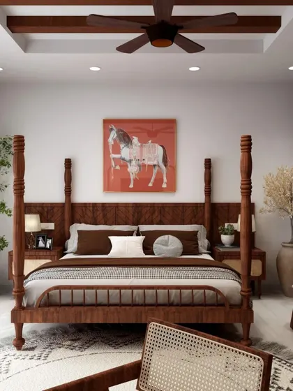 A full view of the bedroom with the four-poster bed, showcasing the exposed wooden beams on the ceiling that add to the room's rustic charm.