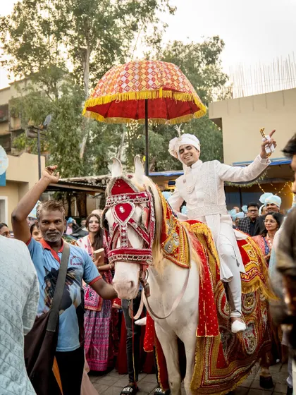 A joyful shot of the groom on his horse, ready to meet his bride. I coordinate every element of the baraat for a seamless and memorable experience.