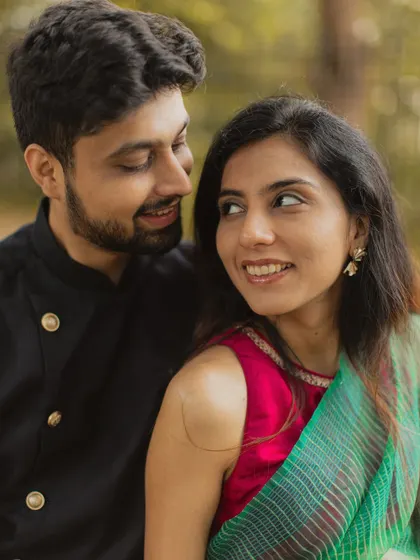 A lovely close-up portrait capturing the sweet glances and smiles shared between the couple.