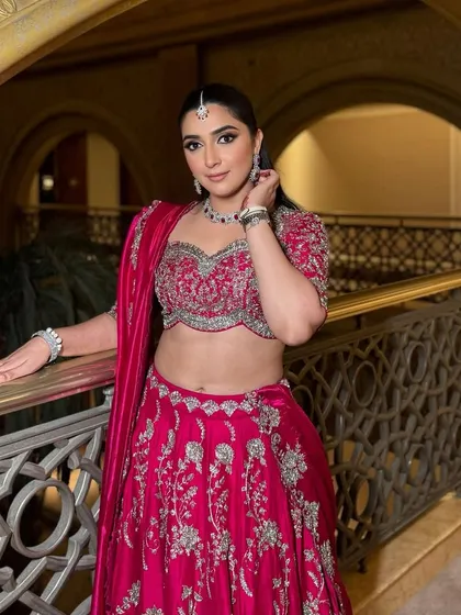 Soft, sultry, and stunning for a pre-wedding event in Abu Dhabi. This gorgeous client slays in her beautiful Rani pink lehenga, paired with shimmery smokey eyes and clean skin.