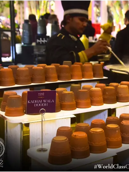 Our traditional "Kadhai Wala Doodh" station, with hot, spiced milk served in rustic clay kulhads. This comforting beverage is a perfect, nostalgic addition to any winter wedding or event.