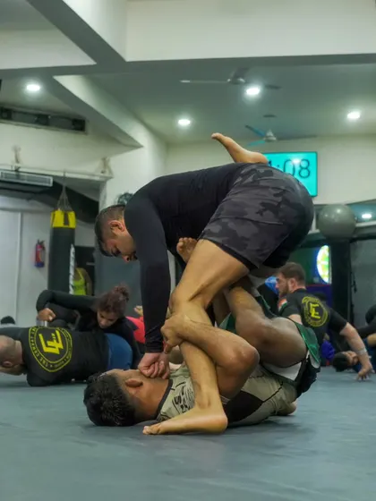 A student works to pass the guard during a No-Gi grappling session. We train for all scenarios, both with and without the Gi.