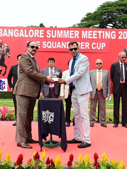 Mr. L. Shiva Shankar, Steward of the Bangalore Turf Club, presents The Squanderer Cup to the owner of Cascais.