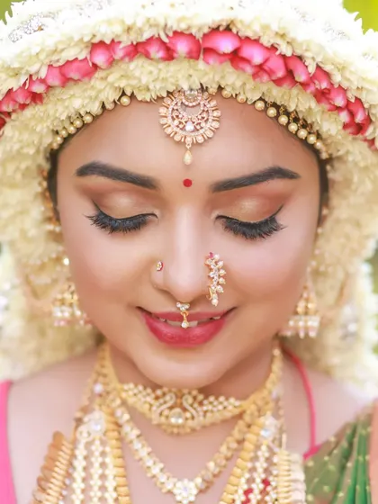 Close-up portraits focusing on the "Sharadha Jalli" hairstyle and bridal makeup. The ring light creates a beautiful, even glow, highlighting the intricate details and the model's features.