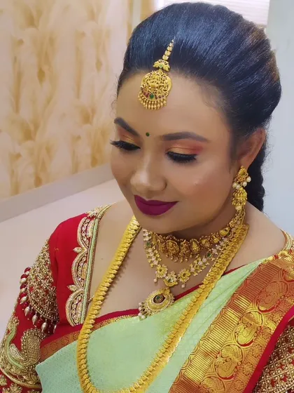 A close-up of the glam look, focusing on the warm-toned eyeshadow and the perfectly matching lipstick.