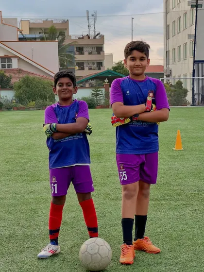 Two of our promising young goalkeepers, Arjun (U-9) and Vismay (U-11), stand ready for action. The future of our goal line is in safe hands.
