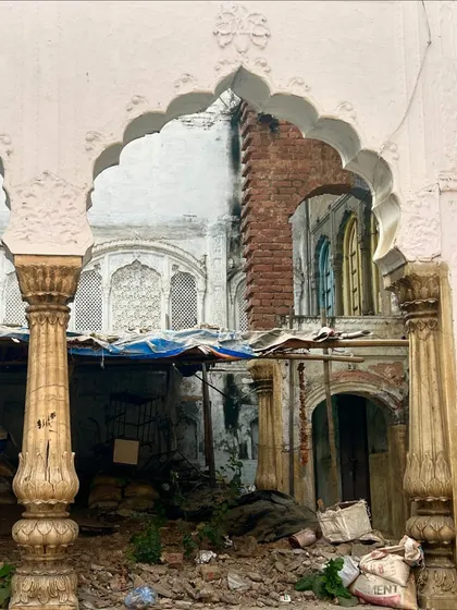 A view through a crumbling archway of a haveli. This photo captures the sense of loss and the beauty in decay that we explore on our 'Vanishing Havelis' walk.