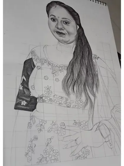 A work-in-progress image of the lehenga sketch. Here, you can see the grid lines and the gradual shading of the hair and clothing.