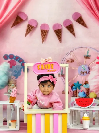 Our candy shop theme is perfect for a sweet celebration, with this little girl serving up smiles from behind the counter.