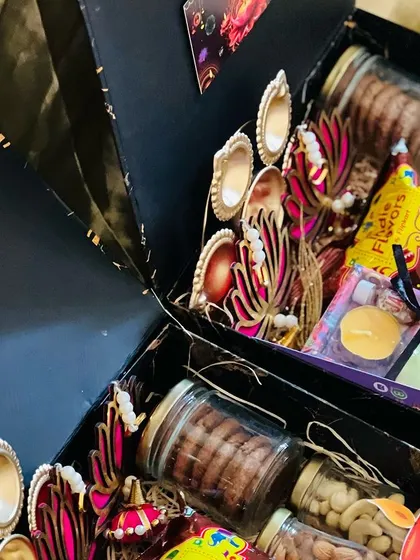 An angled view of the black Diwali boxes, giving a better look at the depth and variety of the contents.