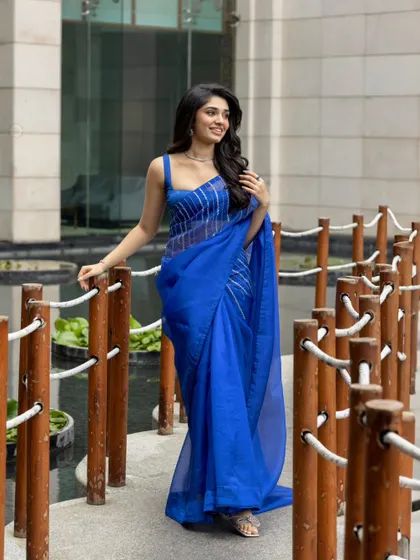 Another beautiful shot of Krithi in the blue saree, capturing her graceful presence.
