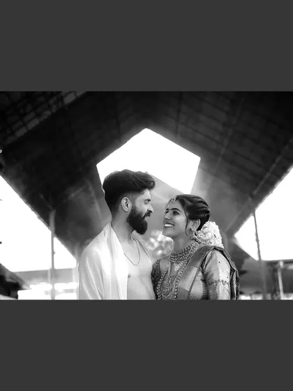 A dramatic black and white silhouette of a couple, using architectural lines to create a powerful image.
