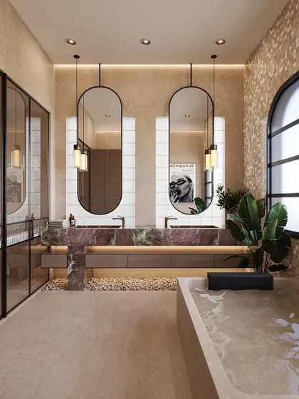 This bathroom is designed to feel like a gentle exhale. The double sink vanity is wrapped in a beautiful, dramatic pink stone, creating a focal point of soft, feminine energy. I layered textured paint on the walls and added mosaic tile accents to evoke a spa-like quality, turning this functional room into a serene retreat.