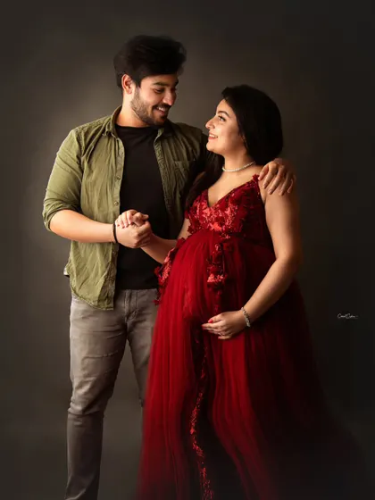The bond between a sister and brother is so special. Here, the brother-to-be holds his pregnant sister's hand, sharing a happy and supportive moment.