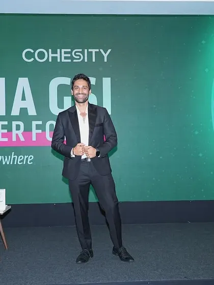 Posing on stage at the Cohesity India GSI Partner Forum. Ready to bring some energy and resilience to the event, one trick at a time.