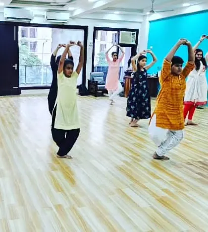 Students in our adult class learning to perfect their hand gestures and upper body movements in a coordinated sequence.