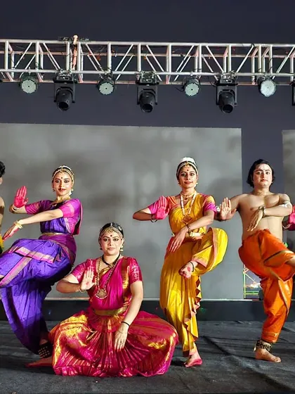 The full ensemble of 'Maheswara' in a dynamic group pose, showcasing the fusion of dance styles that defines this production.
