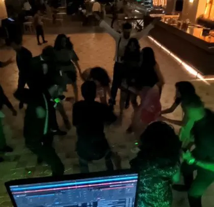 A view from my DJ console of a corporate party that went on until 1 AM.